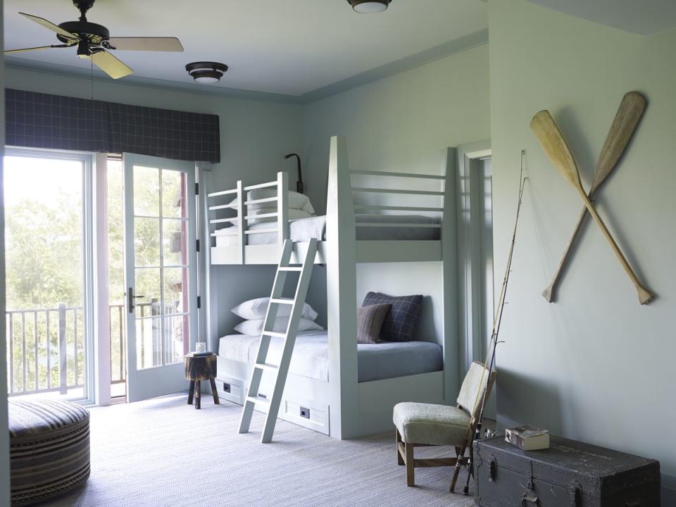 <p>“In this bunk room that overlooks the water, we used Benjamin Moore’s Beach Glass on the walls and Quiet Moments on the beds and trim<em>,”</em> Sesser says. “The soft hues remind me of beach glass and work well with a lot of other colors and materials.”<br></p>