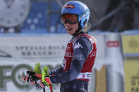 United States' Mikaela Shiffrin gets to the finish area after completing an alpine ski, women's World Cup downhill race, in Cortina d'Ampezzo, Italy, Friday, Jan. 20, 2023. (AP Photo/Alessandro Trovati)