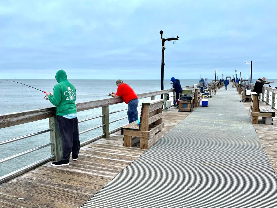 Anglers try their luck at one of several fishing piers on the Brunswick Islands.