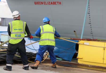 The British aircraft carrier HMS Queen Elizabeth undergoes preparations for its maiden voyage, in its dock at Rosyth, in Scotland, Britain June 21, 2017. Photograph taken on June 21, 2017. REUTERS/Russell Cheyne