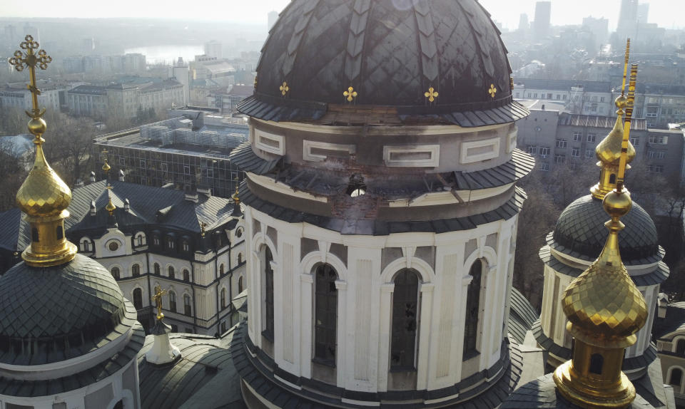 A hole from a shell explosion in the dome of a church is seen after what Russian officials in Donetsk said was a shelling by Ukrainian forces, in Donetsk, the capital of Russian-controlled Donetsk region, eastern Ukraine, Thursday, Dec. 15, 2022. (AP Photo)