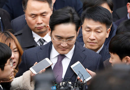 FILE PHOTO - Samsung Group chief, Jay Y. Lee, leaves after attending a court hearing to review a detention warrant request against him at the Seoul Central District Court in Seoul, South Korea, January 18, 2017. REUTERS/Kim Hong-Ji/File Photo