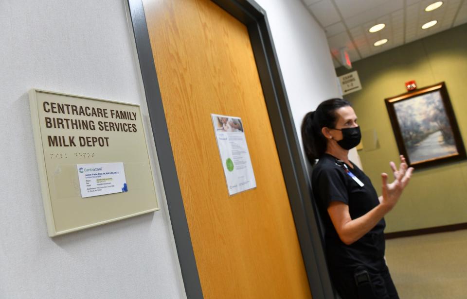 Lactation resource nurse Jeanne Friebe stand near the entrance to the local milk depot during an interview Tuesday, June 7, 2022, at the CentraCare Health Plaza in St. Cloud. 