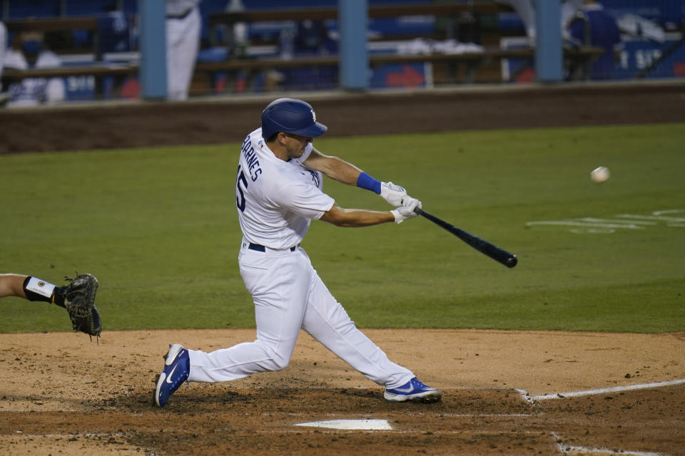 Los Angeles Dodgers' Austin Barnes hits a two-run home run during the fourth inning of a baseball game against the San Diego Padres, Thursday, Aug. 13, 2020, in Los Angeles. (AP Photo/Jae C. Hong)