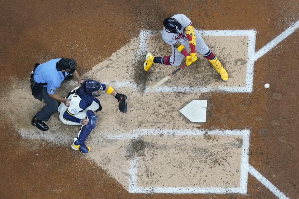 Atlanta Braves' Ronald Acuna Jr. hits an RBI single during the fifth inning of a baseball game against the Milwaukee Brewers Tuesday, May 17, 2022, in Milwaukee. (AP Photo/Morry Gash)