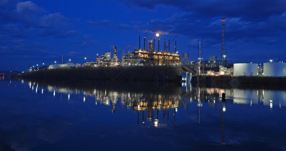 A full moon rises behind the Shell Petrochemicals Complex, an ethane cracker plant located in Potter Township, Pennsylvania, on the shore of the Ohio River.