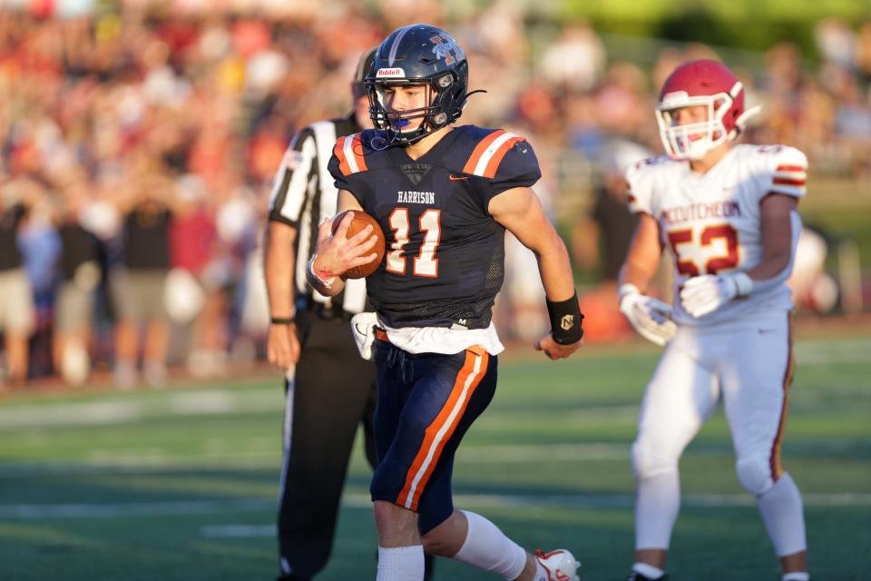 Harrison Raiders quarterback Ben Henderson (11) runs in a touchdown on the McCutcheon Mavericks defense during the IHSAA football game, Friday, Sep. 9, 2022, in West Lafayette, Ind.