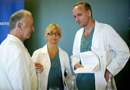 Professor Mats Brannstrom (R), head of a medical team which performed its first uterus transplant on a patient, speaks to team members Andreas Tzakis (L) and Pernilla Dahm-Kahler during a news conference about the procedure at the Sahlgreska University Hospital in Gothenburg September 18, 2012. REUTERS/Adam Ihse/TT News Agency