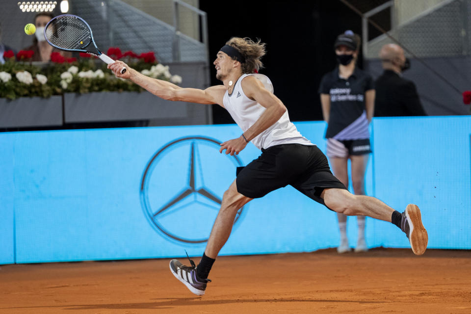 Germany's Alexander Zverev returns the ball to Italy's Matteo Berrettini during the men's final match at the Mutua Madrid Open tennis tournament in Madrid, Spain, Sunday, May 9, 2021. (AP Photo/Bernat Armangue)