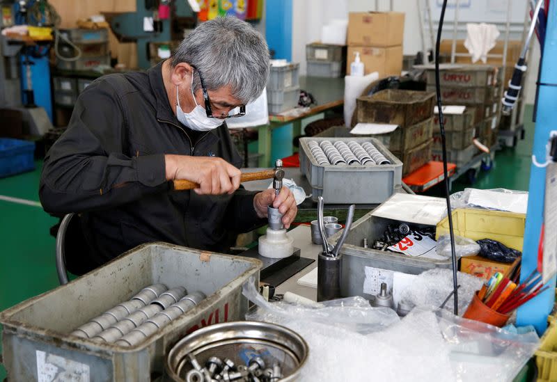 FILE PHOTO: Worker assembles an air drill at the factory of manufacturer Katsui Kogyo in Higashiosaka