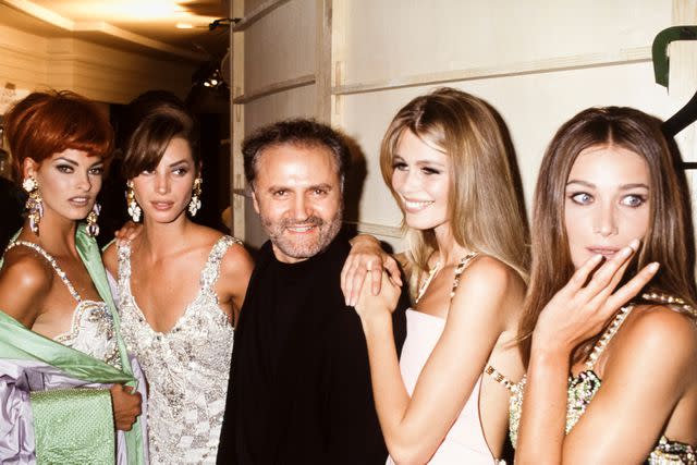 <p>PAT/ARNAL/Gamma-Rapho via Getty</p> Gianni Versace with Linda Evangelista, Christy Turlington, Claudia Schiffe and Carla Bruni