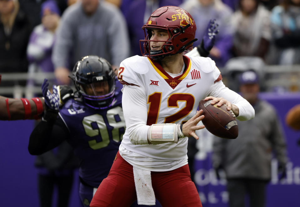 FORT WORTH, TX - NOVEMBER 26: quarterback Hunter Dekkers #12 of the Iowa State Cyclones looks to throw against the TCU Horned Frogs at Amon G. Carter Stadium on November 26, 2022 in Fort Worth, Texas. (Photo by Ron Jenkins/Getty Images)