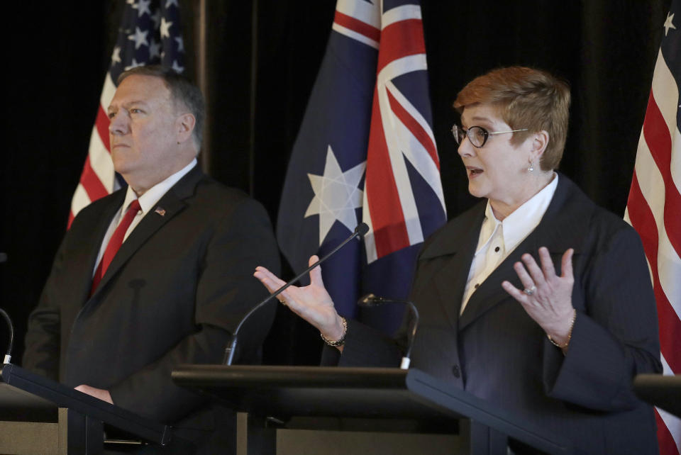 U.S. Secretary of State Mike Pompeo, left, listens as Australian Foreign Minister Marise Payne, makes a point during a press conference following annual bilateral talks in Sydney, Australia, Sunday, Aug. 4, 2019. (AP Photo/Rick Rycroft)