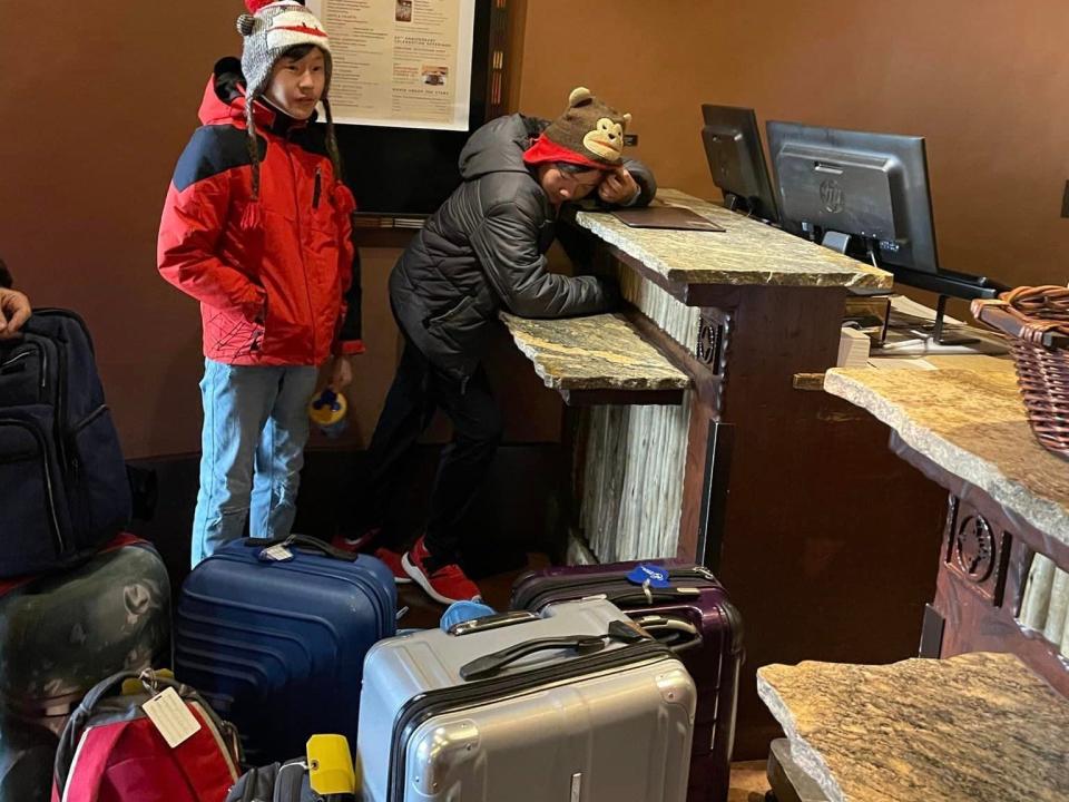 jills kids slumping on luggage in bell services at a disney world resort