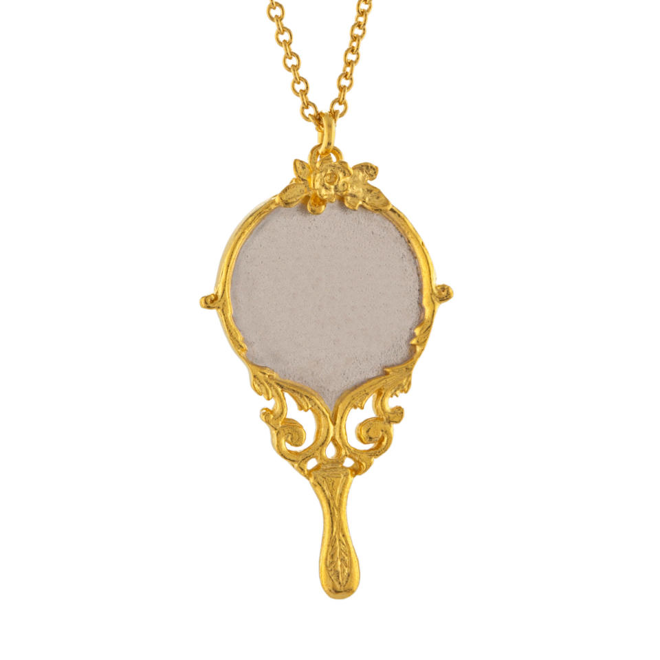 <p>Baroque Hand Mirror Necklace engraved with "Tale as Old as Time", gold-plated with silver detail, £180</p>