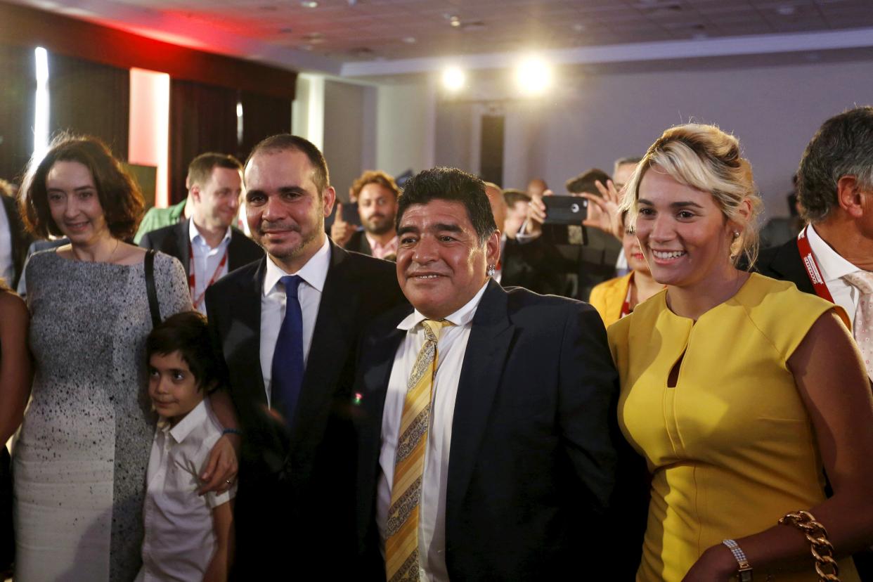 Jordan&#39;s Prince Ali Bin Al Hussein (3rd L), FIFA presidential candidate, and his wife Princess Reem (L), his son Prince Abdullah (2nd L) poses with Argentina&#39;s former soccer player Diego Maradona (2nd R) and his partner Rocio Oliva, after Maradona spoke in the Soccerex Asian Forum on developing the business of football in Asia at the King Hussein Convention Center at the Dead Sea, Jordan, May 4, 2015. Maradona launched a blistering attack on FIFA president Sepp Blatter on Monday saying that world soccer&#39;s governing body had descended into anarchy with the 79-year-old Swiss in charge. REUTERS/Muhammad Hamed