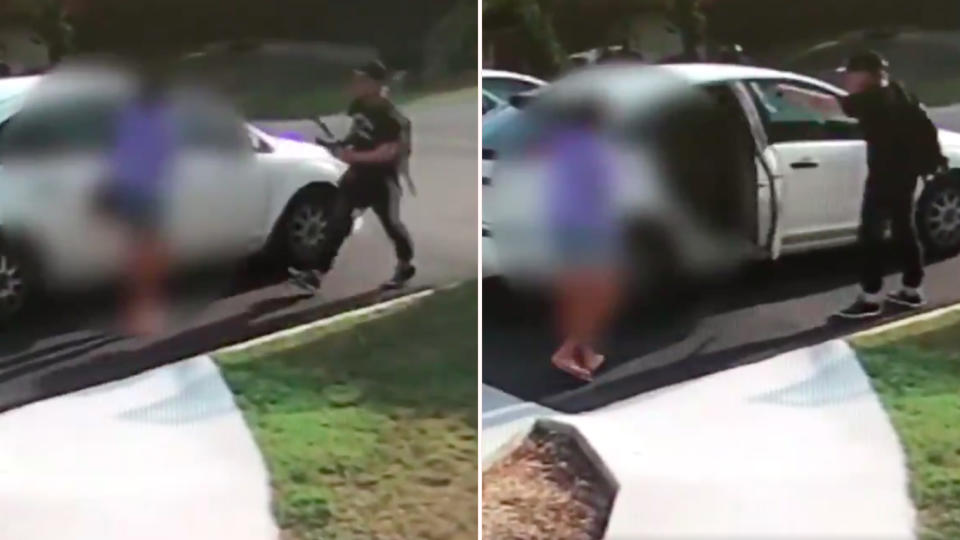 An armed carjacker was captured on video threatening a mother and her kids with an axe and sword. Source: Queensland Police