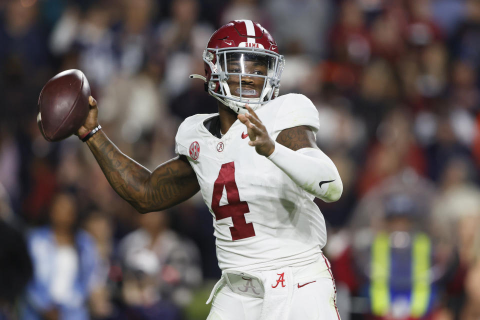 Alabama quarterback Jalen Milroe looks to throw a pass during the second half of an NCAA college football game against Auburn, Saturday, Nov. 25, 2023, in Auburn, Ala. (AP Photo/Butch Dill)