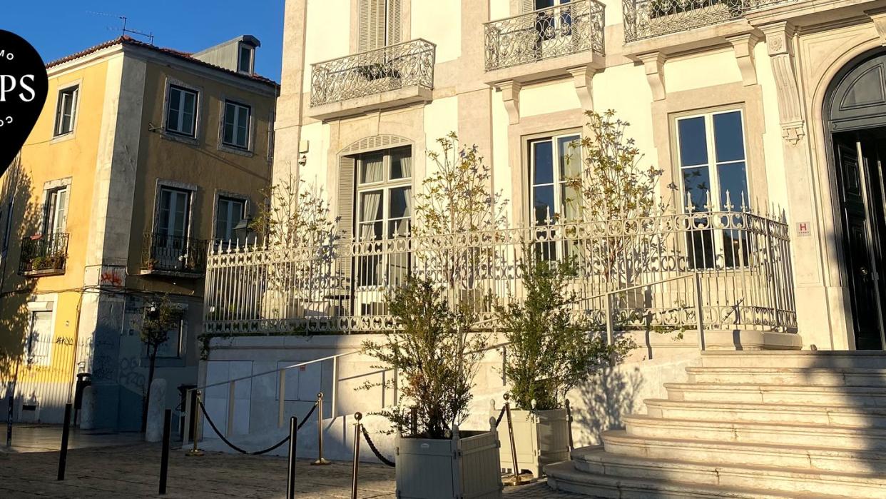 a building with trees and stairs