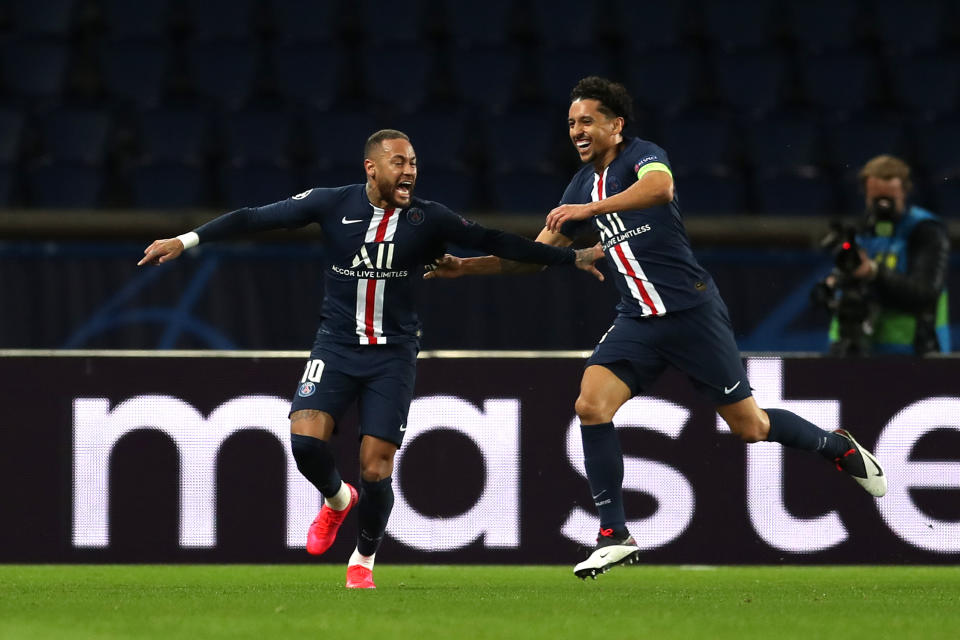 Neymar runs and celebrates with Marquinhos after scoring his team's first goal.