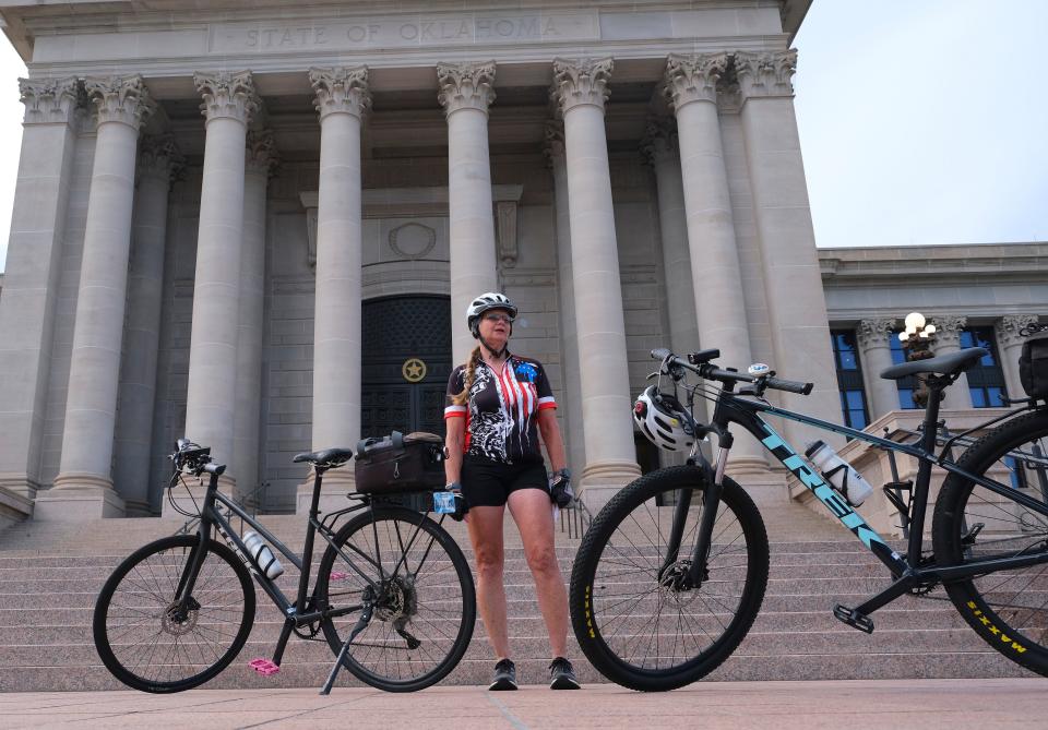 Cyclist Karen Canfield speaks on Wednesday at the Capitol before participants embark on the 2024 Ride of Silence, a worldwide slow ride in silence to honor those who have been injured or killed while cycling on public roads.