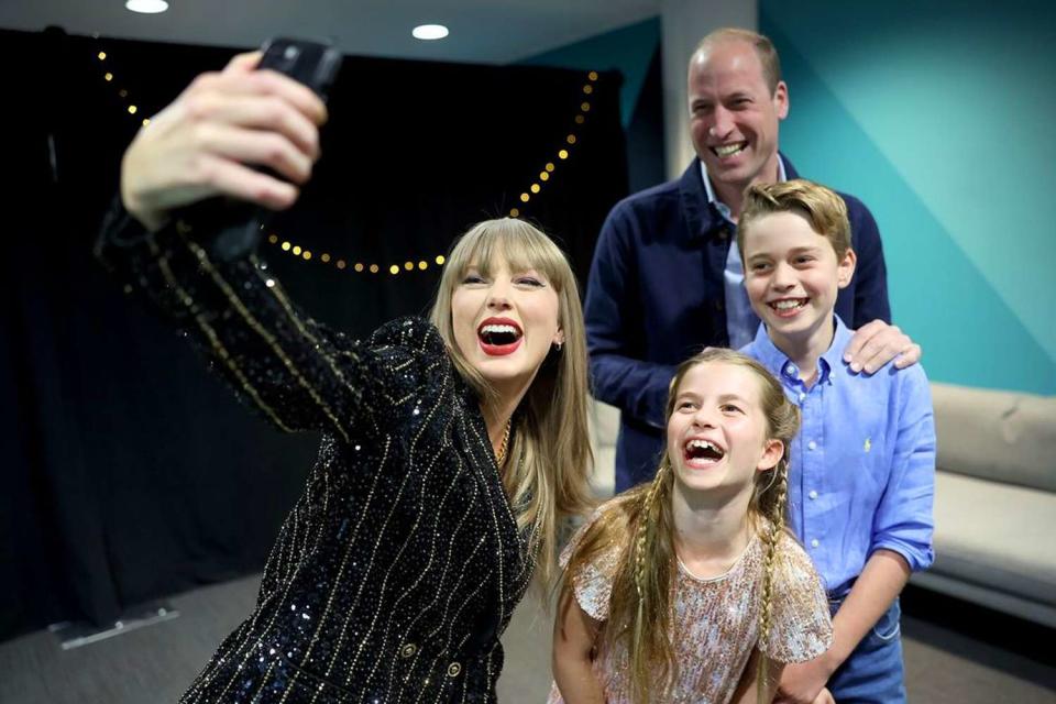 <p>Prince and Princess of Wales/Instagram</p> Taylor Swift poses for a photo with Prince William, Princess Charlotte and Prince George