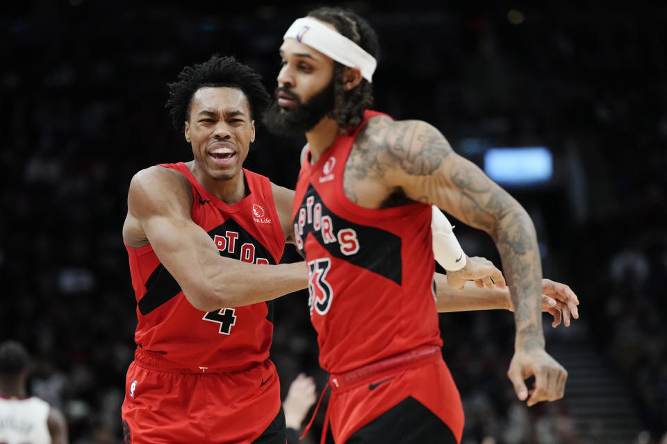 Toronto Raptors forward Scottie Barnes (4) and guard Gary Trent Jr. (33) celebrate a basket against the Miami Heat during the second half of an NBA basketball game Wednesday, Jan. 17, 2024, in Toronto. (Frank Gunn/The Canadian Press via AP)