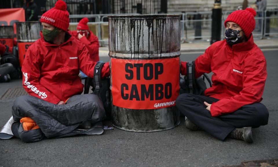 Members of Greenpeace protest outside Downing Street against the Cambo oilfield