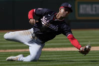 Washington Nationals third baseman Trey Lipscomb catches a pop up hit by Oakland Athletics' Ryan Noda during the eighth inning of a baseball game Sunday, April 14, 2024, in Oakland, Calif. (AP Photo/Godofredo A. Vásquez)