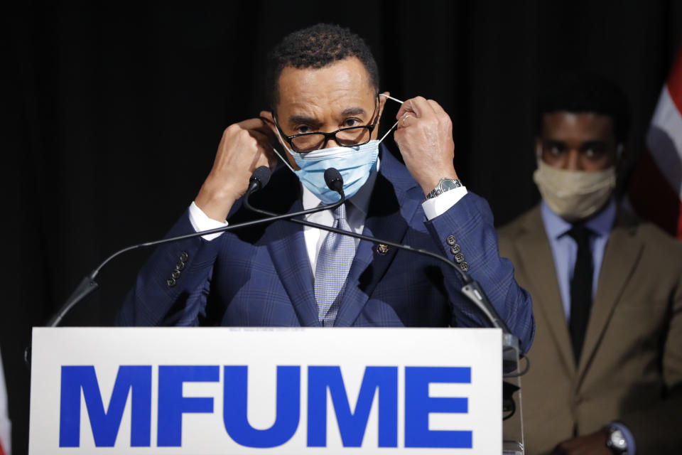 Democrat Kweisi Mfume removes a face mask before addressing reporters during an election night news conference after he won the 7th Congressional District special election, Tuesday, April 28, 2020, in Baltimore. Mfume defeated Republican Kimberly Klacik to finish the term of the late Rep. Elijah Cummings, retaking a Maryland congressional seat Mfume held for five terms before leaving to lead the NAACP. All voters in the 7th Congressional District were strongly urged to vote by mail in an unprecedented election dramatically reshaped by the coronavirus pandemic. (AP Photo/Julio Cortez)