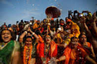 Lakshmi Narayan Tripathi (C), chief of the "Kinnar Akhada" congregation for transgender people and other members take a dip during the first "Shahi Snan" (grand bath) at "Kumbh Mela" or the Pitcher Festival, in Prayagraj, previously known as Allahabad, India, January 15, 2019. REUTERS/Danish Siddiqui