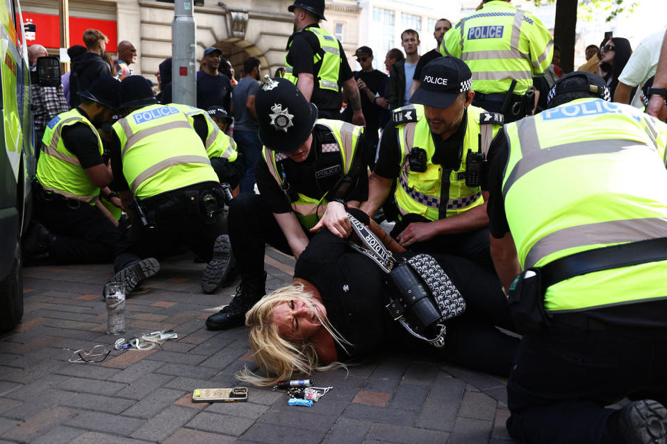 UK police prepared for planned far-right protests and other demonstrations this weekend after two nights of unrest in several English towns and cities following a mass stabbing that killed three girls.  (Darren Staples/AFP-Getty Images)