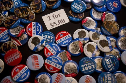 US President Barack Obama campaign buttons are seen for sale at a campaign event in Oakland, California, on July 23