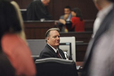 Michael Dunn looks at his family during his murder trial in the shooting death of unarmed teen Jordan Davis, in Duval County Courthouse in Jacksonville, Florida February 10, 2014. Dunn is accused of first degree murder in death of Davis after an altercation over loud rap music at a Florida gas station in November 2012. REUTERS/Bob Mack/Pool