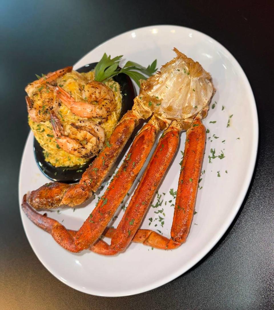 Royaltee seafood rice at Prominent Bar and Restaurant in Byron. The entree is described on the menu as seasoned Sazon rice with a combination of shrimp and crabmeat served with one snow crab cluster.