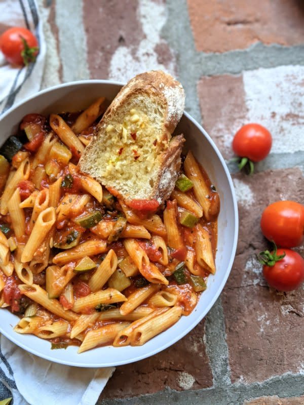 <p>The Herbeevore</p><p>This Instant Pot penne pasta is fresh, saucy and loaded with healthy vegetables! Ready in about 15 minutes. This is a simple and healthy meal, and perfect for those nights when you are too busy to cook.</p><p><strong>Get the recipe: <a href="http://theherbeevore.com/instant-pot-penne-pasta-recipe-vegan-gluten-free/" rel="nofollow noopener" target="_blank" data-ylk="slk:Instant Pot Penne Pasta;elm:context_link;itc:0;sec:content-canvas" class="link rapid-noclick-resp">Instant Pot Penne Pasta</a></strong></p>