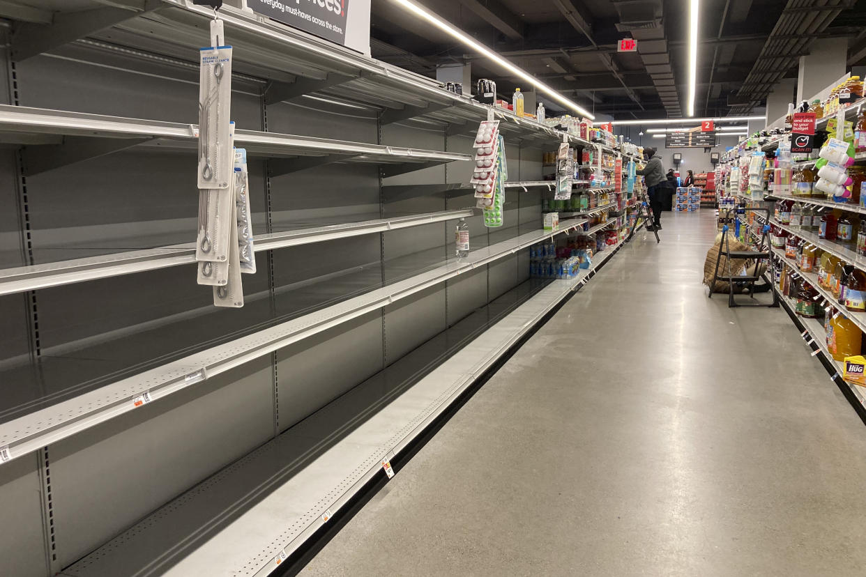 Shelves stand empty of bottle water following a chemical spill into the Delaware River upstream from Philadelphia, Tuesday, March 28, 2023. Health officials in Bucks County, just north of Philadelphia, said Sunday that thousands of gallons of a water-based latex finishing solution spilled into the river late Friday due to a leak at the Trinseo Altuglas chemical facility in Bristol Township. (AP Photo/Matt Rourke)