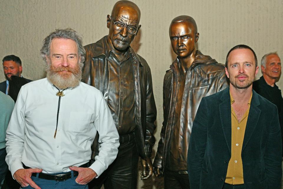 ALBUQUERQUE, NEW MEXICO - JULY 29: Actor Bryan Cranston (L) and actor Aaron Paul pose with bronze statues depicting television characters Walter White, played by Cranston, and Jesse Pinkman, played by Paul, from the series "Breaking Bad" at the Albuquerque Convention Center on July 29, 2022 in Albuquerque, New Mexico. The statues were commissioned in 2019 by Sony Pictures Television and were sculpted by artist Trevor Grove and cast by Burbank, California-based American Fine Arts Foundry. (Photo by Sam Wasson/Getty Images)