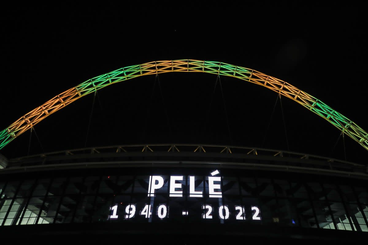 The Wembley arch is lit up in the colours of Brazil in memory of Pele (Kieran Cleeves/PA). (PA Wire)