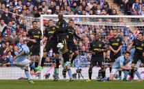 Manchester City's Carlos Tevez shoots from a free-kick