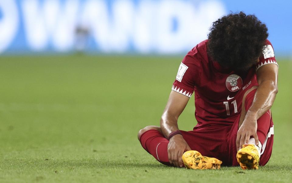  A dejected Akram Afif of Qatar reacts at full time during the FIFA World Cup Qatar 2022 Group A match between Qatar and Senegal - Getty Images