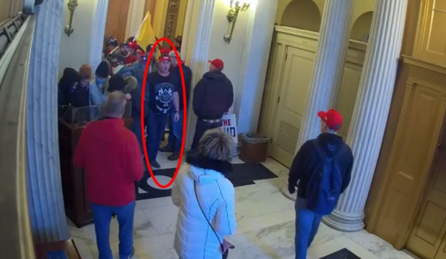 Schubert (circled in red) in the Upper House Door area. (DOJ)