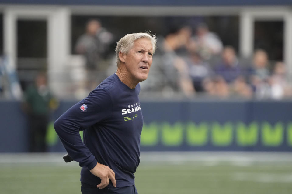 Seattle Seahawks head coach Pete Carroll looks toward the scoreboard during the first half of a preseason NFL football game against the Chicago Bears, Thursday, Aug. 18, 2022, in Seattle. (AP Photo/Stephen Brashear)