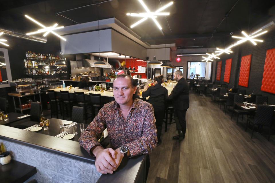 Don Swartz, owner, stands inside his Veneto Wood Fired Pizza & Pasta on East Avenue. The popular Rochester restaurant has reopened after extensive remodeling following a fire in the building in January.