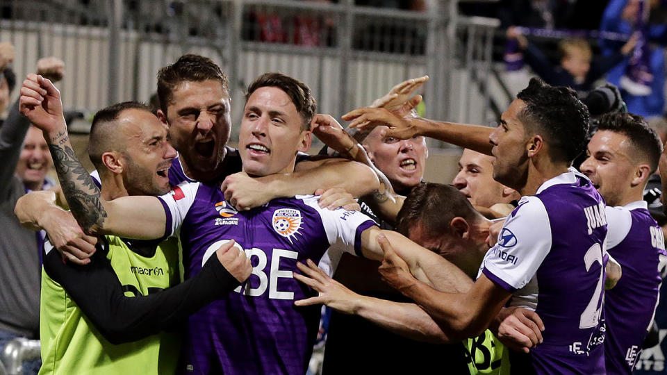 Scott Neville celebrates with Glory fans. (Photo by Will Russell/Getty Images)