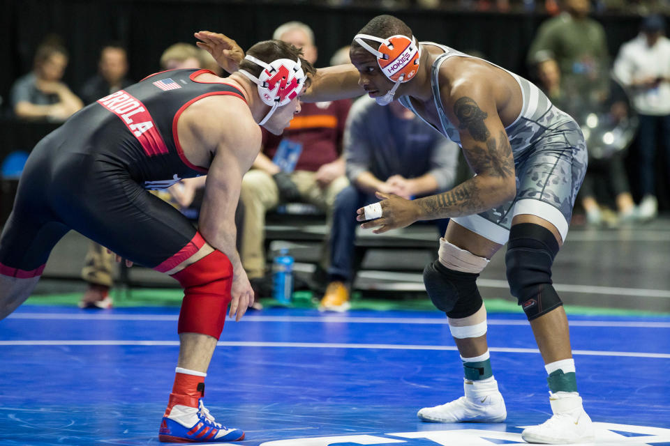 Mar 17, 2023; Tulsa, OK, USA; Virginia Tech wrestler Mekhi Lewis (right) wrestles Nebraska wrestler Mikey Labriola in a 174-pound weight class semifinal match during the NCAA Wrestling Championships at the BOK Center.  Mandatory Credit: Brett Rojo-USA TODAY Sports