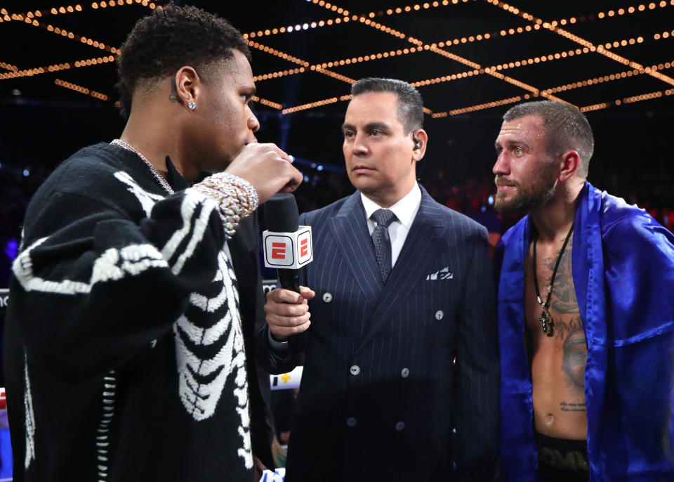 NEW YORK, NEW YORK - OCTOBER 29: (L-R) Devin Haney; Bernardo Osuna and Vasiliy Lomachenko talk about a future fight at The Hulu Theater at Madison Square Garden on October 29, 2022 in New York City. (Photo by Mikey Williams/Top Rank Inc via Getty Images)