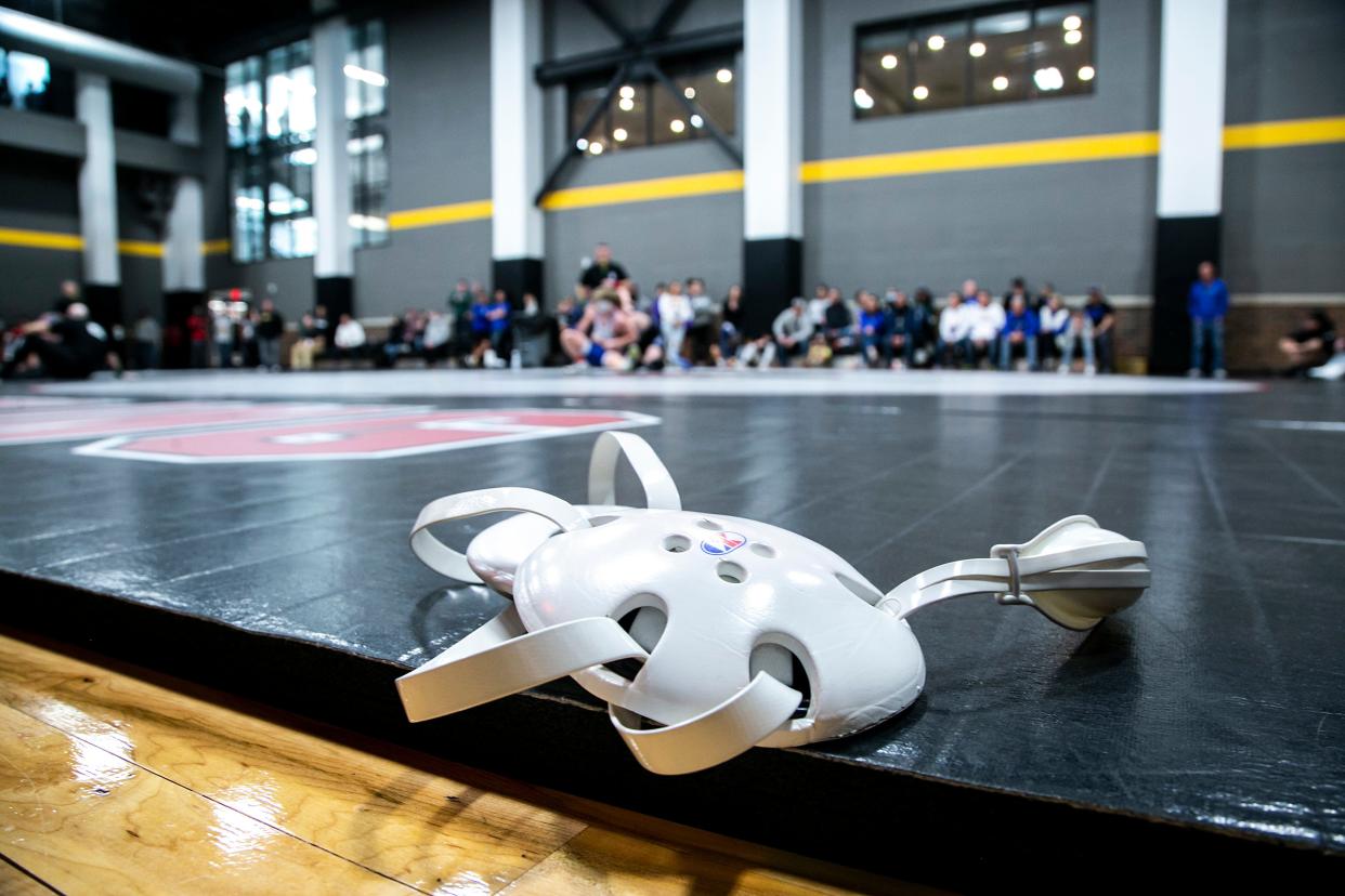 A set of Cliff Keen headgear is seen during the Dan Gable Donnybrook high school wrestling tournament, Friday, Dec. 3, 2021, at the Xtream Arena in Coralville, Iowa.