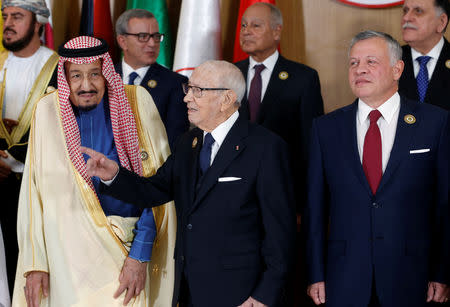 Tunisian President Beji Caid Essebsi gestures as he stands near Saudi Arabia's King Salman bin Abdulaziz and Jordan's King Abdullah II during the group photo with Arab leaders, ahead of the 30th Arab Summit in Tunis, Tunisia March 31, 2019. REUTERS/Zoubeir Souissi/Pool