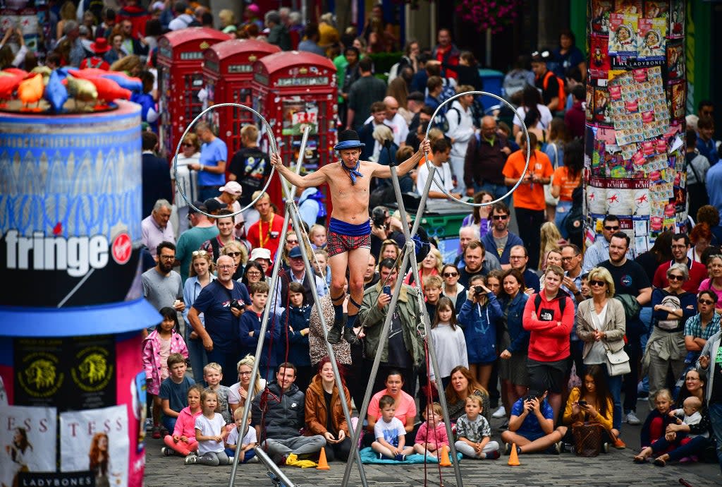 An entertainer performs on the Royal Mile in the Scottish capital (Getty)